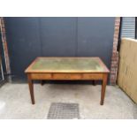 An early 20th century desk, green tooled leather inlay, and three drawers, size H77cm x W152cm x