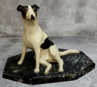 An early 20th century painted plaster library model of a Jack Russell on a faux marble base c.