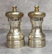 A silver salt & pepper mill set, A J Poole, Birmingham, 2000 Millennium hall mark approx. 282g gross