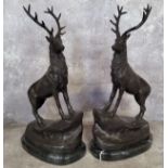 After Jules Moigniez, a pair of bronze stags standing on rocky outcrop, raised on a marble base,