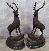 After Jules Moigniez, a pair of bronze stags standing on rocky outcrop, raised on a marble base,