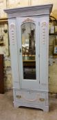 A 19th century French single wardrobe with applied Neo Classical swags, single drawer to frieze,
