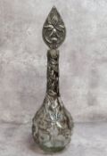 A period Art Nouveau globe and stem shaft vase decorated with sinuous pewter applied reliefwork