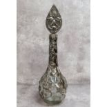 A period Art Nouveau globe and stem shaft vase decorated with sinuous pewter applied reliefwork