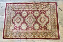 A contemporary Turkish rug in tones of deep terracotta 170cm x 120cm