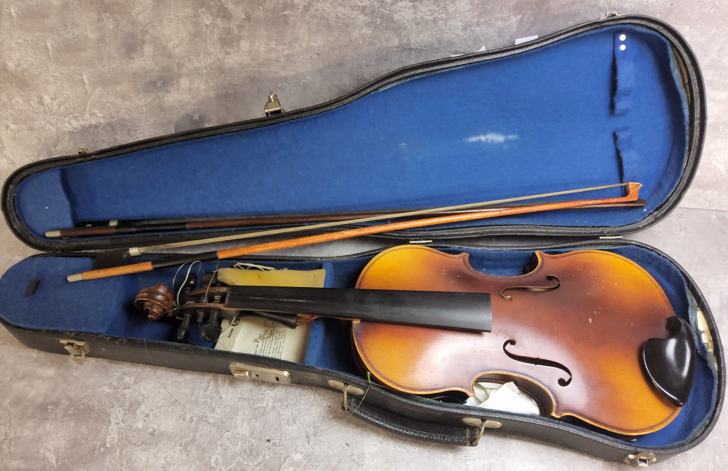 A 20th century Stradivarius Cremonensis violin 1/10, a mother inlaid bow, another, cased