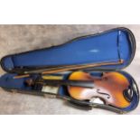 A 20th century Stradivarius Cremonensis violin 1/10, a mother inlaid bow, another, cased