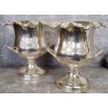 A pair silver plated two handled campana shaped champagne coolers 32cms high