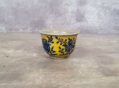 Oriental Ceramics - a Chinese tea bowl the yellow ground crackle glaze tea bowl decorated with