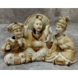 Oriental Ceramics- a Chinese porcelain 'nodding' bisque figural group depicting central emperor