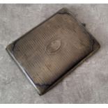 A continental silver cigarette case engraved & chased decoration, scroll spandrels blue enamel