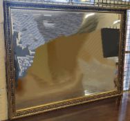 A large contemporary rectangular silvered & gilt wall mirror 130 x 95cms