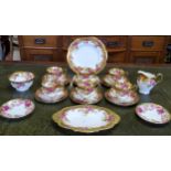 A Royal Chelsea Golden Rose pattern tea set for six decorated with bold gilt borders decorated