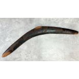 A late 19th century Aboriginal boomerang carved with Cassowary or emu walking in the open-plain c.