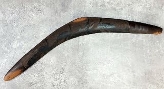 A late 19th century Aboriginal boomerang carved with Cassowary or emu walking in the open-plain c.