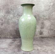 Oriental Ceramics - A 20th century Chinese celadon vase, the slender baluster shaped vase