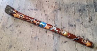 An Aboriginal didgeridoo, with applied white, black and blue dot detailing of a snake and emu, 147cm