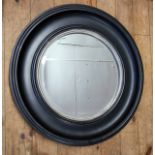 A convex mirror with bold black frame, 68cm diameter