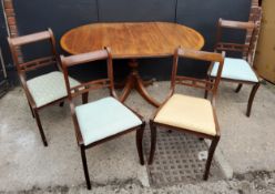 Oval Mahogany dining table and four chairs, bronze casters Table H75 x W 65 (extended 138) x D91cm