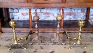 Two pairs of substantial country house brass andirons terminating in ball finials