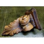 A substantial boldly carved chestnut wall hanging corner sconce 40cm high x 29cm d x 29cm w