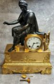 A monumental French gilt metal and bronze clock surmounted with a classical figure, striking on a