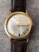 A Garrard 9ct gold gentleman's wristwatch, 17 jewel movement, stamped Garrard, a silvered dial, gold