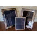 Three silver photograph frames