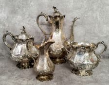 An impressive Victorian Martin Hall & Co. Sheffield silverplate four piece chased with a family