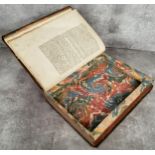 An unusual early 18th century French decorative leather bound book with hidden compartment made