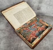 An unusual early 18th century French decorative leather bound book with hidden compartment made