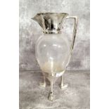 A silver plated mounted glass claret jug after a Design By Christopher Dresser, hinged cover the