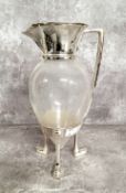 A silver plated mounted glass claret jug after a Design By Christopher Dresser, hinged cover the