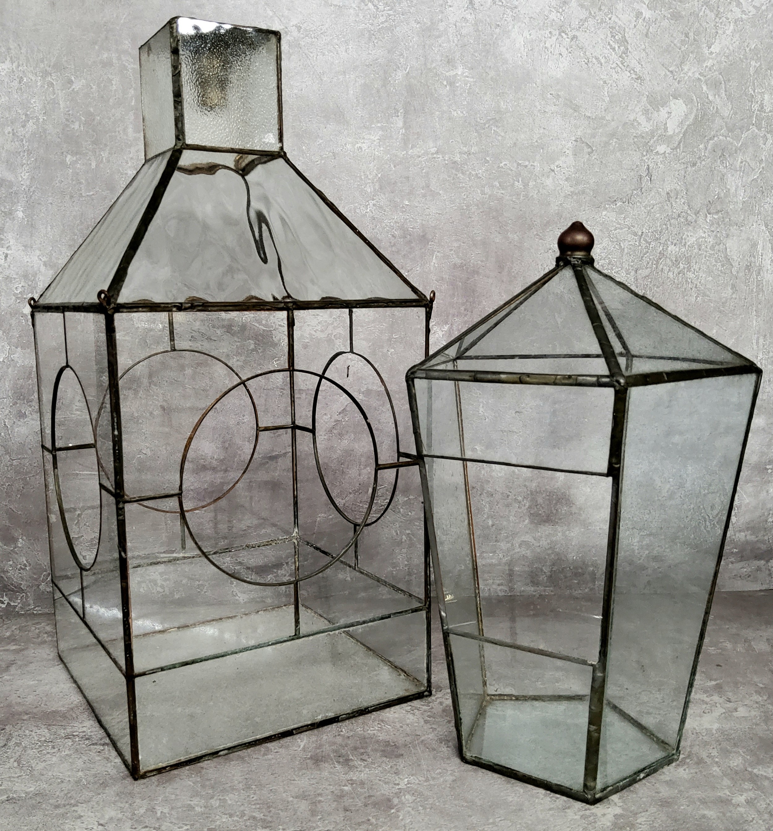 Two Victorian type botanical terrariums, the largest 38cm high