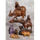 Oriental Objects - A Chinese carved amethyst or quartz monkey; Japanese netsuke in the form of a
