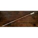 A signed Meiji Period Japanese walking cane, the novelty carved bone pommel carved as a Samurai