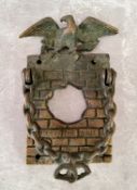 An unusual early 20th century brass 'Hole In The Wall' door knocker / door bell surround