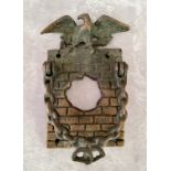 An unusual early 20th century brass 'Hole In The Wall' door knocker / door bell surround