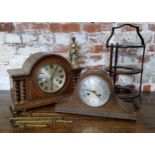 A bold early 20th century oak mantel clock with barley twist columns, with key; another Napoleon