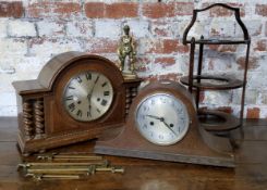 A bold early 20th century oak mantel clock with barley twist columns, with key; another Napoleon