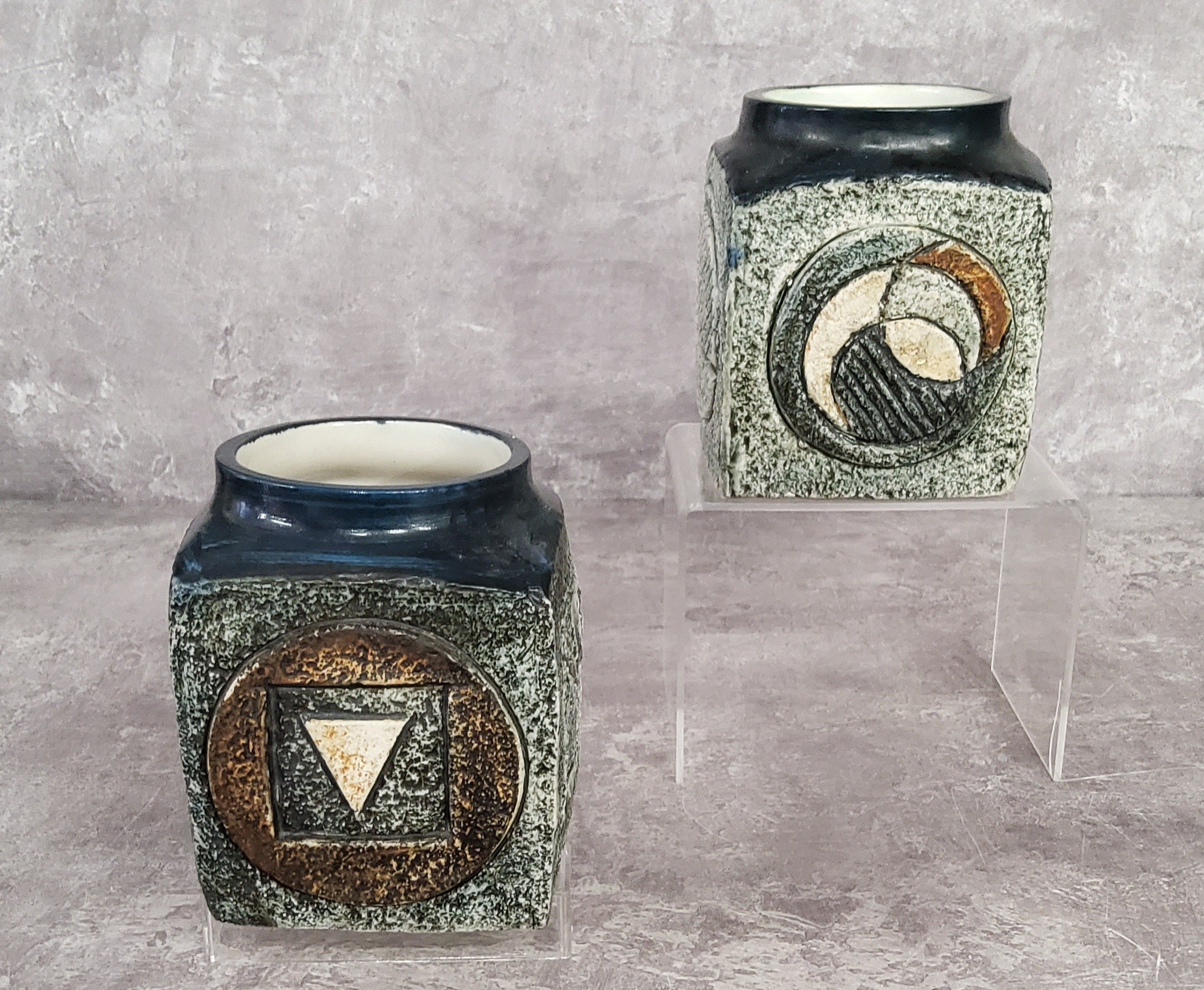 A pair of Troika Pottery marmalade pots decorated by Linda Hazel with incised and painted abstract