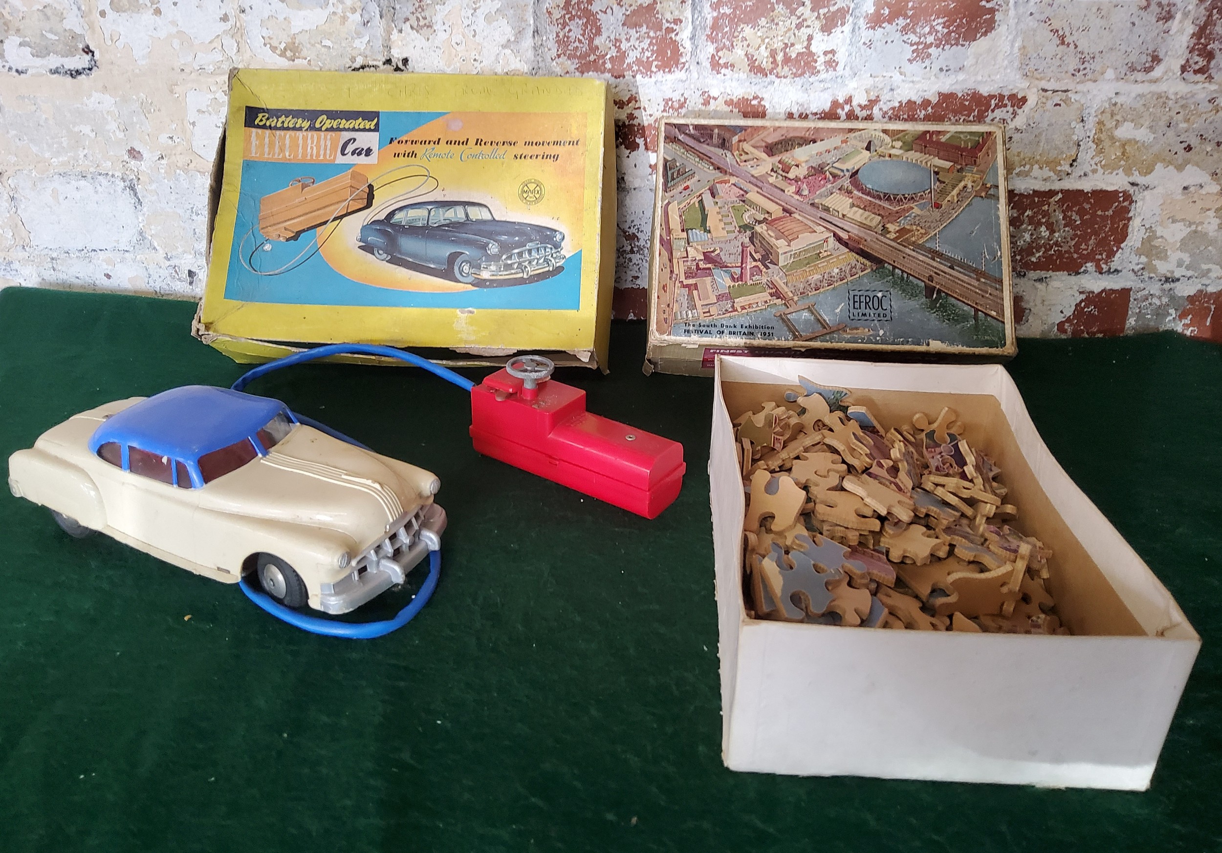 A Marx Toys Battery operated Electric car, boxed; an EROC Ltd. wooden jig-saw 'The South Bank