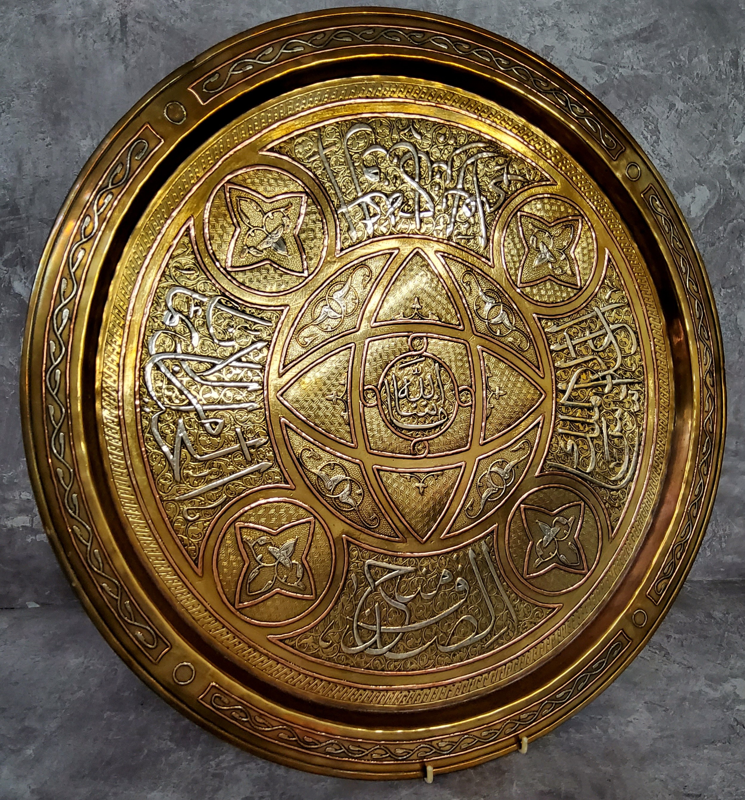 A substantial 19th century silver inlaid brass Middle Eastern charger, inset silver Arabian