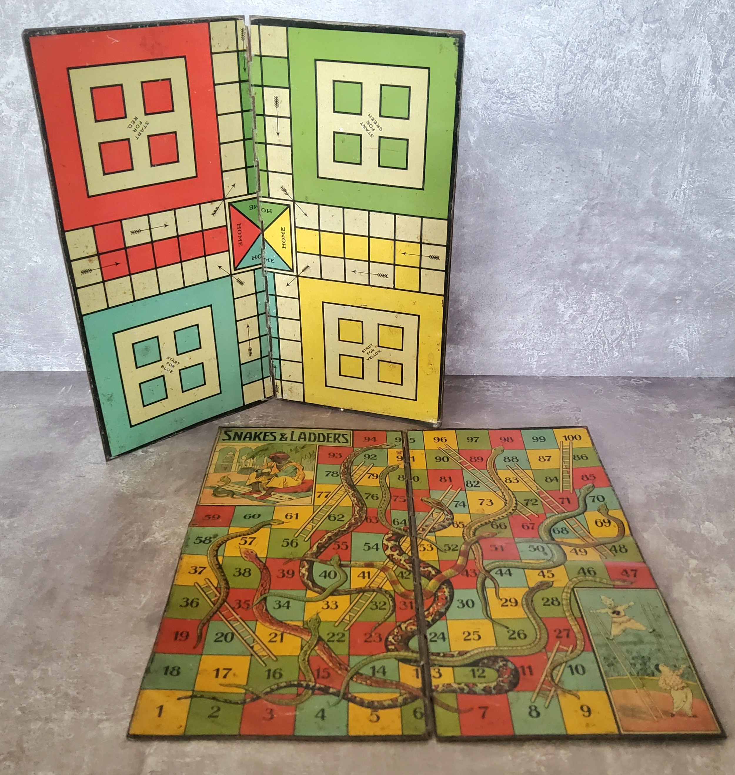 A Burnett Limited, Birmingham tinplate Ludo game board; another Snakes & Ladders (2)