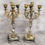 A pair of 19th century French gilt metal mounted marble three branch candlestick garnitures c.