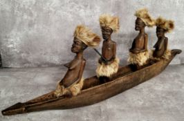 Tribal - a large African carving of a boat, each figure with hyena fur traditional tribal dress 75cm