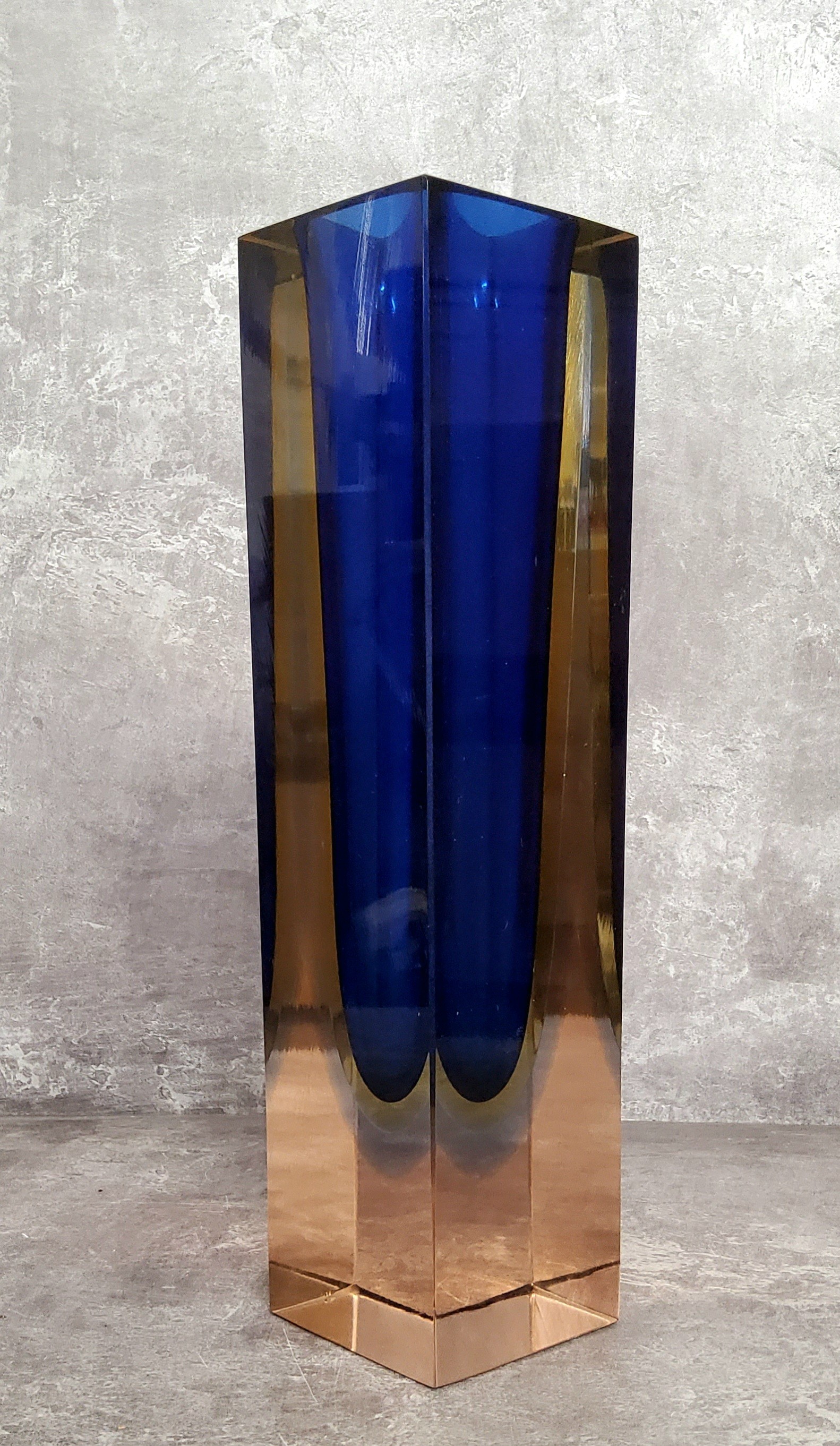 A bold mid century rectangular coloured glass vase, four uniformed coloured glass bands set within a