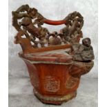 An unusual cinnabar lacquered Chinese rice basket, with Dog Of Fo and blossoming carved carrying