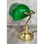 A library desk reading lamp, swivel green shade on a turned brass weighted base