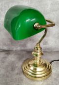 A library desk reading lamp, swivel green shade on a turned brass weighted base